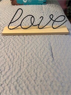 Source Unknown Black Wire 'Love' Script on Natural Wood Base
